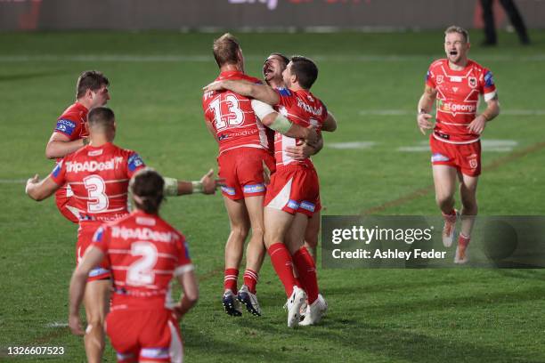 Dragons players celebrate the win from a Golden Point from Corey Norman during the round 16 NRL match between New Zealand Warriors and the St George...