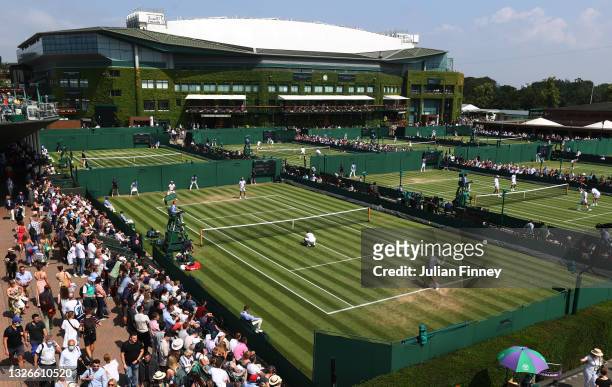General view of play on Court 8 during the Men's Doubles First Round match between Lloyd Harris of South Africa and Alexei Popyrin of Australia...