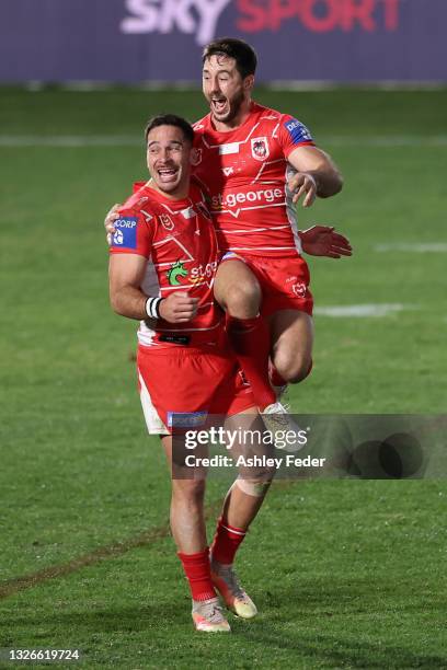 Corey Norman of the Dragons celebrates the win from his field goal with his team mates during the round 16 NRL match between New Zealand Warriors and...