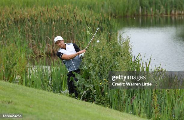 Haotong Li of China plays his second shot on the 18th hole during Day Two of The Dubai Duty Free Irish Open at Mount Juliet Golf Club on July 02,...