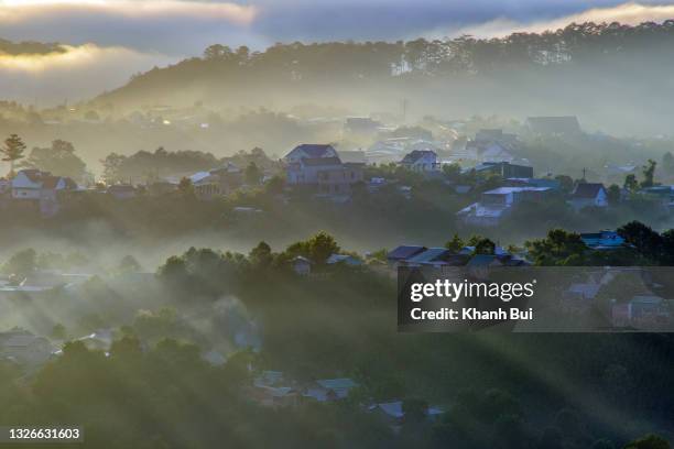 fairy small village in the fog with magic sunlight at sunrise - movie awards arrivals stock pictures, royalty-free photos & images