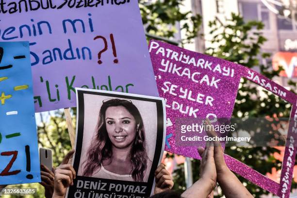 Demonstrators hold up placards during a protest against the Turkish government's withdrawal from the Istanbul Convention, a human rights treaty aimed...