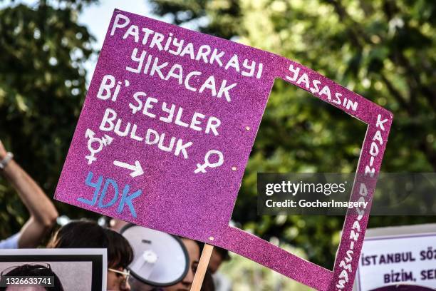 Demonstrator holds up a placard during a protest against the Turkish government's withdrawal from the Istanbul Convention, a human rights treaty...