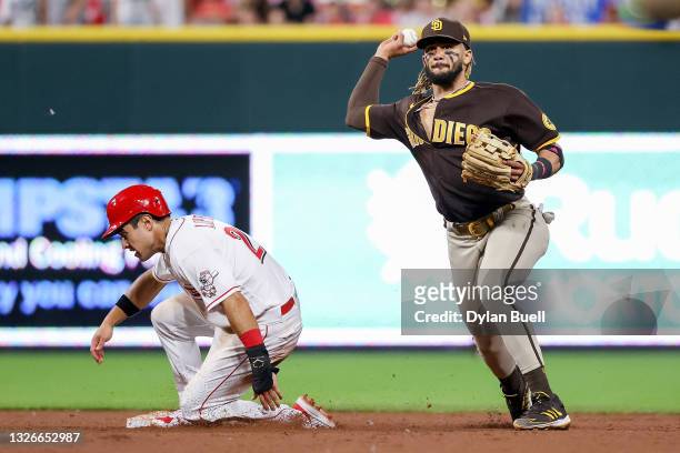 Fernando Tatis of the San Diego Padres attempts to turn a double play past Alejo Lopez of the Cincinnati Reds in the seventh inning at Great American...
