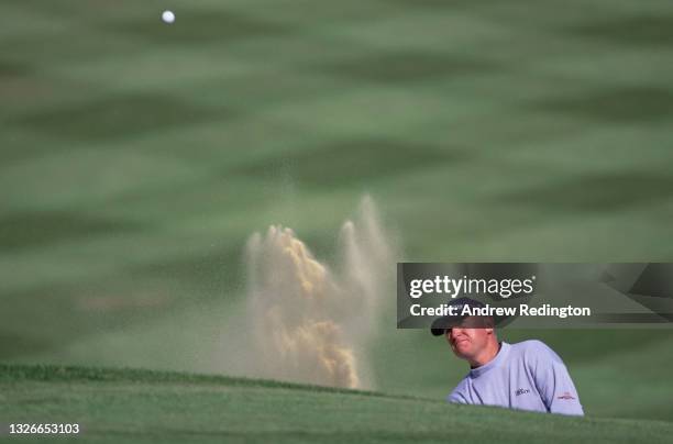 Roger Chapman of Great Britain follows the golf ball after playing a chip shot out of the sand bunker during the 2001 Victor Chandler British Masters...