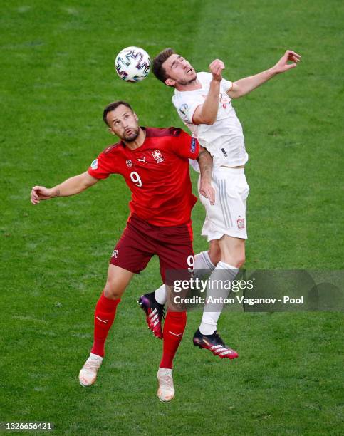 Aymeric Laporte of Spain competes for a header with Haris Seferovic of Switzerland during the UEFA Euro 2020 Championship Quarter-final match between...