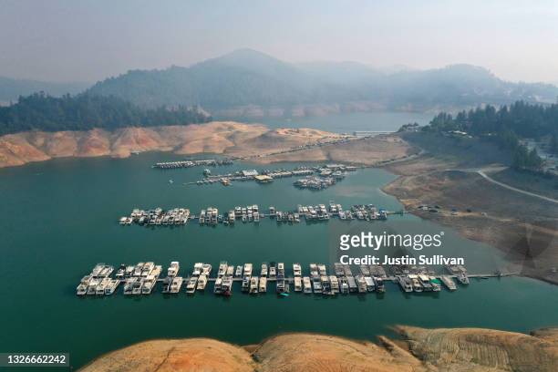 In an aerial view, low water levels are visible at Shasta Lake on July 02, 2021 in Redding, California. As the extreme drought emergency continues in...