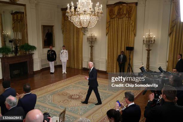 President Joe Biden walks into the East Room for a celebration of the 2020 World Series champion Los Angeles Dodgers at White House on July 02, 2021...