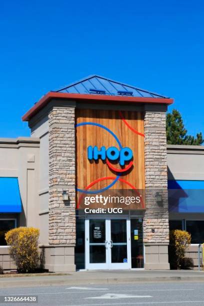 International House of Pancakes restaurant entrance showing IHOP logo, Spokane Valley, Washington mall, a multinational pancake house headquartered...