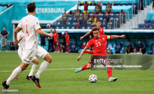 Xherdan Shaqiri of Switzerland scores their side's first goal during the UEFA Euro 2020 Championship Quarter-final match between Switzerland and...