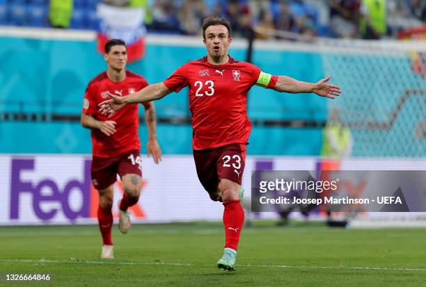 Xherdan Shaqiri of Switzerland celebrates after scoring their side's first goal during the UEFA Euro 2020 Championship Quarter-final match between...