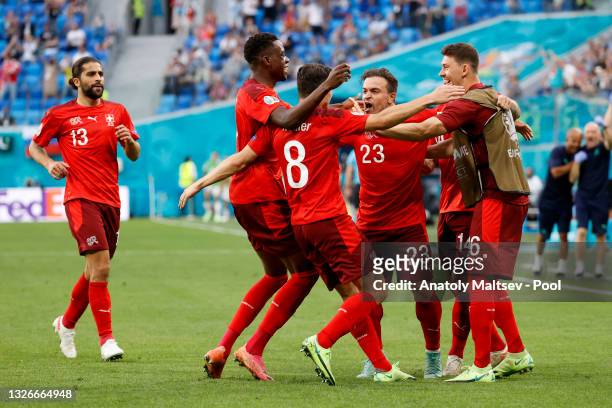 Xherdan Shaqiri of Switzerland celebrates with team mates after scoring their side's first goal during the UEFA Euro 2020 Championship Quarter-final...