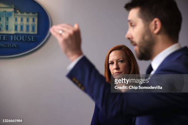 National Economic Council Director Brian Deese and White House Press Secretary Jen Psaki talk to reporters during the daily news conference in the...