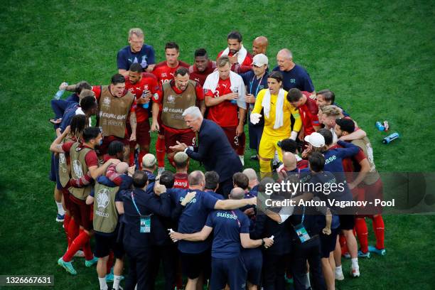 Vladimir Petkovic, Head Coach of Switzerland speaks to his players during a huddle as they prepare for extra time during the UEFA Euro 2020...