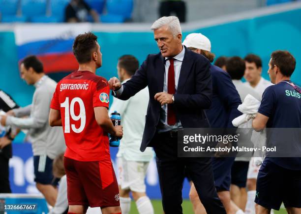 Vladimir Petkovic, Head Coach of Switzerland speaks with Mario Gavranovic of Switzerland during the UEFA Euro 2020 Championship Quarter-final match...