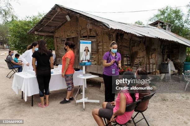 latin people on medical brigade in rural area with nurse - brigades stock pictures, royalty-free photos & images