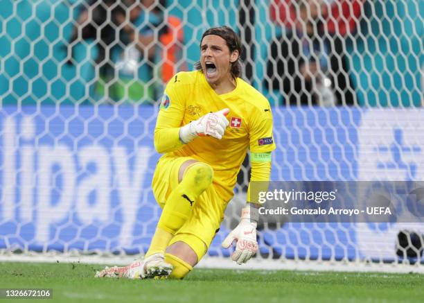 Yann Sommer of Switzerland reacts after saving the Spain third penalty taken by Rodri during the UEFA Euro 2020 Championship Quarter-final match...