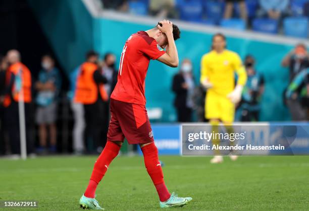 Ruben Vargas of Switzerland reacts after missing their team's fourth penalty in the penalty shoot out during the UEFA Euro 2020 Championship...