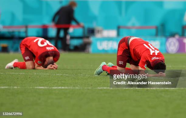 Fabian Schar and Ruben Vargas of Switzerland look dejected after the UEFA Euro 2020 Championship Quarter-final match between Switzerland and Spain at...