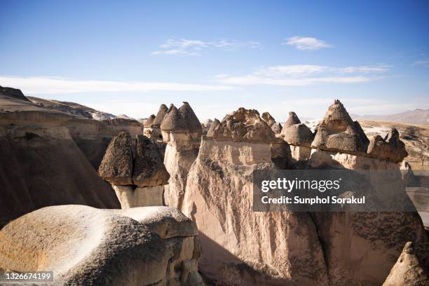 a fairy look alike rock formation at pasabag valley, cappadocia, turkey - capadócia imagens e fotografias de stock