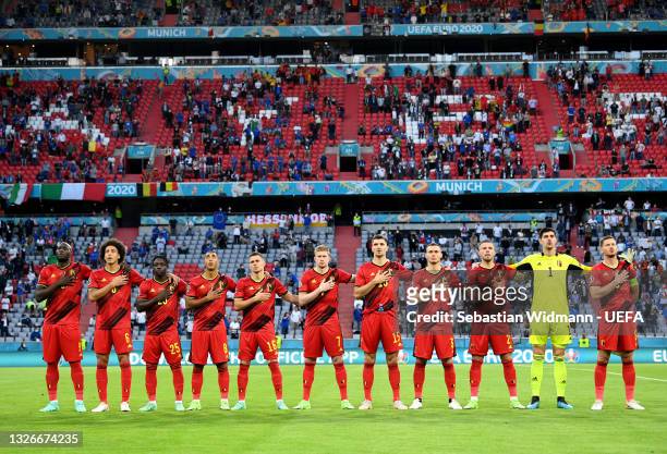 Players of Belgium stand for the national anthem prior to the UEFA Euro 2020 Championship Quarter-final match between Belgium and Italy at Football...