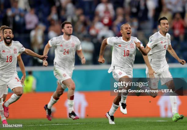 Thiago Alcantara of Spain celebrates with teammates after victory in the penalty shoot out during the UEFA Euro 2020 Championship Quarter-final match...