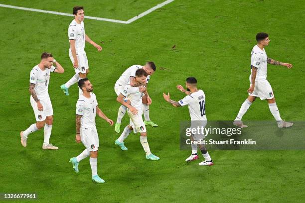 Nicolo Barella of Italy celebrates with team mates after scoring their side's first goal during the UEFA Euro 2020 Championship Quarter-final match...