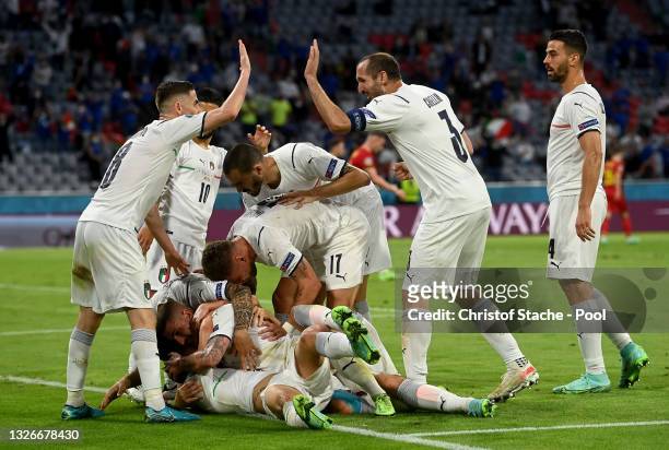 Nicolo Barella of Italy celebrates with team mates after scoring their side's first goal during the UEFA Euro 2020 Championship Quarter-final match...