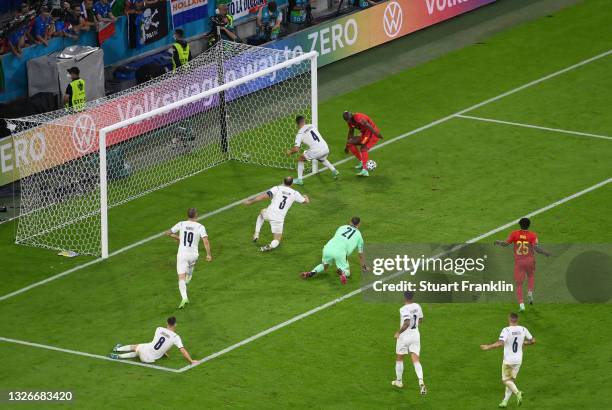 Romelu Lukaku of Belgium has a shot blocked by Leonardo Spinazzola of Italy during the UEFA Euro 2020 Championship Quarter-final match between...