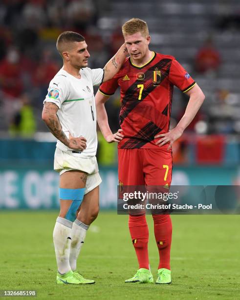 Marco Verratti of Italy interacts with Kevin De Bruyne of Belgium as he looks dejected during the UEFA Euro 2020 Championship Quarter-final match...