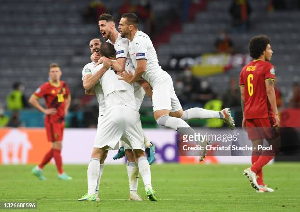 Jorginho and Giorgio Chiellini of Italy celebrate with teammates after victory in the UEFA Euro 2020 Championship Quarter-final match between Belgium...