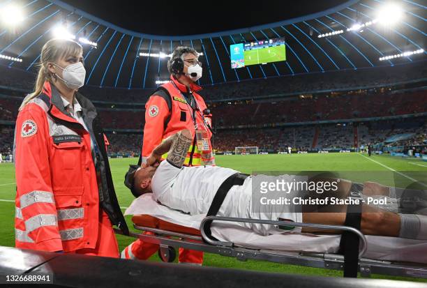 Leonardo Spinazzola of Italy leaves the pitch on a stretcher during the UEFA Euro 2020 Championship Quarter-final match between Belgium and Italy at...