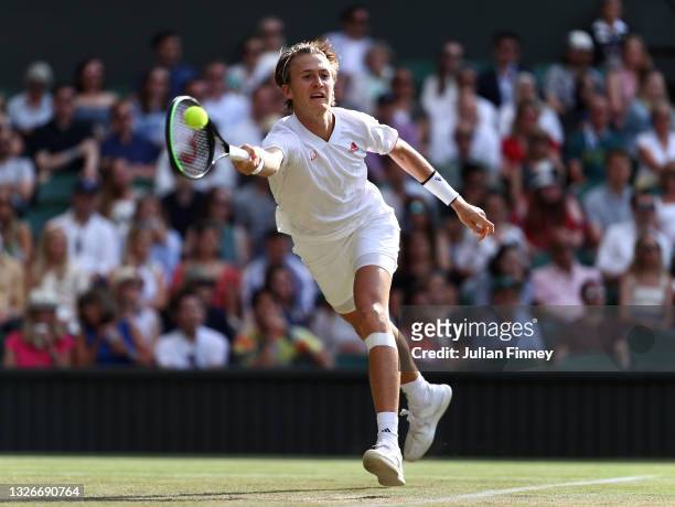 Sebastian Korda of USA returns a forehand against Daniel Evans of Great Britain during their men's singles third Round match on Day Five of The...