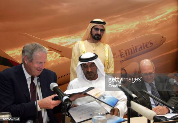 Chairman and chief executive of Emirates, Sheikh Ahmed bin Saeed Al-Maktoum swap the purchase agreement for 50 Boeing 777 planes with president and...