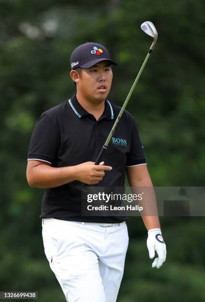 Byeong-hun An of South Korea prepares to putt on the eighth green during the second round of the Rocket Mortgage Classic on July 02, 2021 at the...