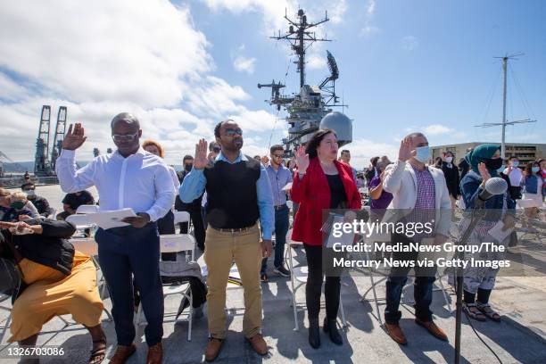 New American citizens take the Oath of Allegiance led by U.S. Citizenship and Immigration Services San Francisco Field Office Director Richard...