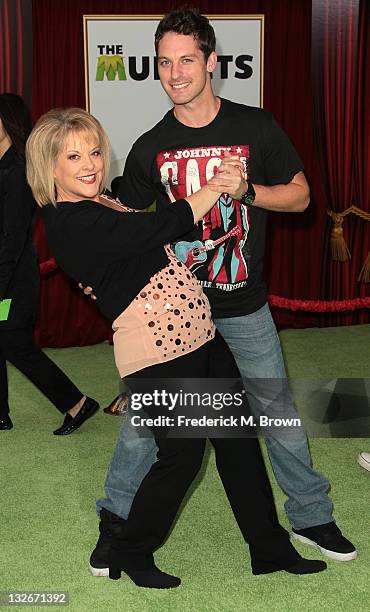 Television host Nancy Grace and Tristan MacManus attend the Premiere Of Walt Disney Pictures' "The Muppets" at the El Capitan Theatre on November 12,...