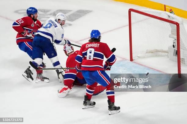 Tyler Johnson of the Tampa Bay Lightning scores a goal past Carey Price of the Montreal Canadiens during the third period in Game Three of the 2021...