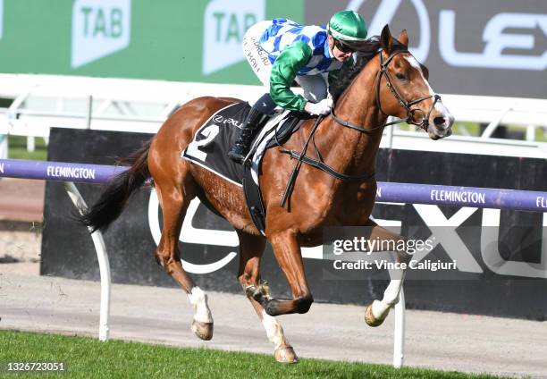 Jamie Kah riding Grand Promenade winning Race 3, the Lexus Banjo Paterson Series Final, during Melbourne Racing at Flemington Racecourse on July 03,...