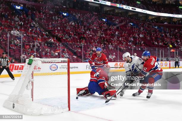 Tyler Johnson of the Tampa Bay Lightning scores a goal past Carey Price of the Montreal Canadiens during the third period in Game Three of the 2021...