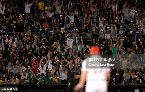 Fans do the wave during the Boston Red Sox game against the Oakland Athletics at RingCentral Coliseum on July 02, 2021 in Oakland, California.