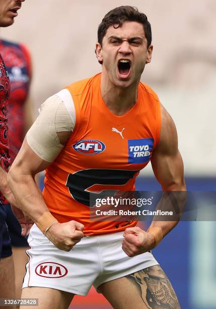 Tim Taranto of the Giants celebrates after scoring a goal during the round 16 AFL match between Melbourne Demons and Greater Western Sydney Giants at...