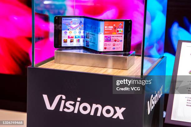 Multi foldable organic light-emitting diode screen is on display at the Visionox booth during 2021 Display Innovation Convention Expo at Shanghai New...