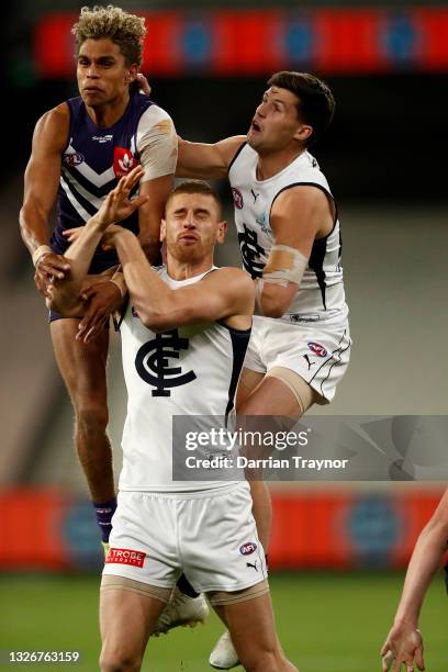 Liam Henry of the Dockers spoils Liam Jones of the Blues during the round 16 AFL match between Fremantle Dockers and Carlton Blues at the Melbourne...