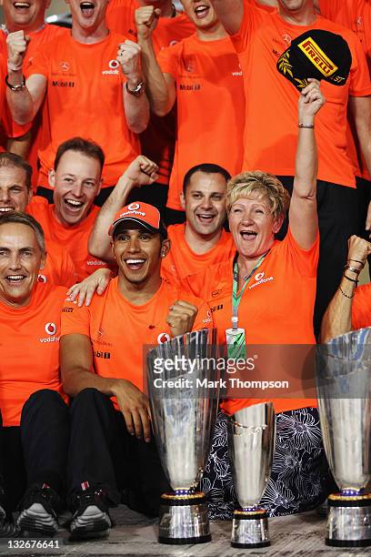 Lewis Hamilton of Great Britain and McLaren celebrates with his mother Carmen Lockhart and team mates after winning the Abu Dhabi Formula One Grand...