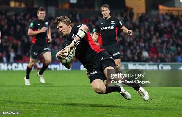 David Strettle of Saracens dives over to score the second Saracens try during the Heineken Cup match between Saracens and Benetton Treviso at...