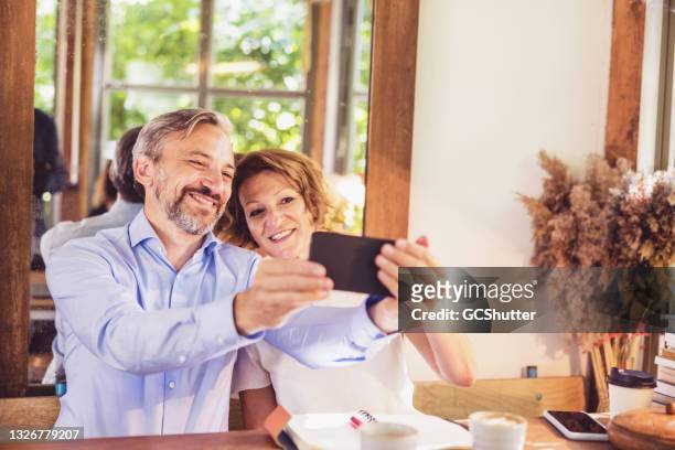 group portrait of a senior couple - happy anniversary stock pictures, royalty-free photos & images