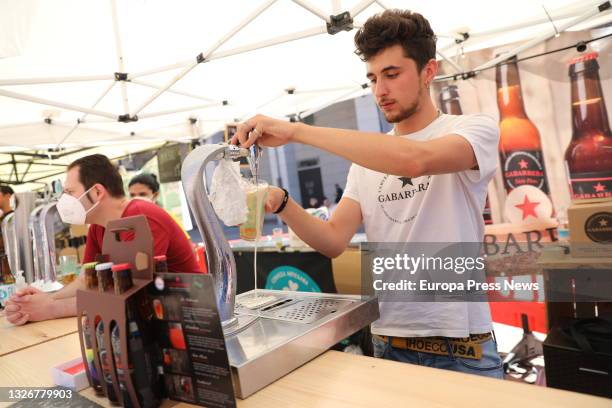 Waiter serves a tube of beer, in the facilities of the Leganes Beer Festival, on 3 July, 2021 in the Plaza Mayor of Leganes, Madrid, Spain. The...