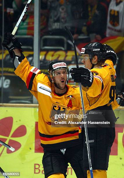 Philip Gogulla of Germany celebrates scoring the 2nd goal with his team mate Kai Hospelt during the 6th match of the German Ice Hockey Cup 2011...