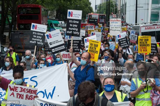 Workers gather at University College Hospital before marching down Tottenham Court road towards a rally at Downing Street to demand better pay on...